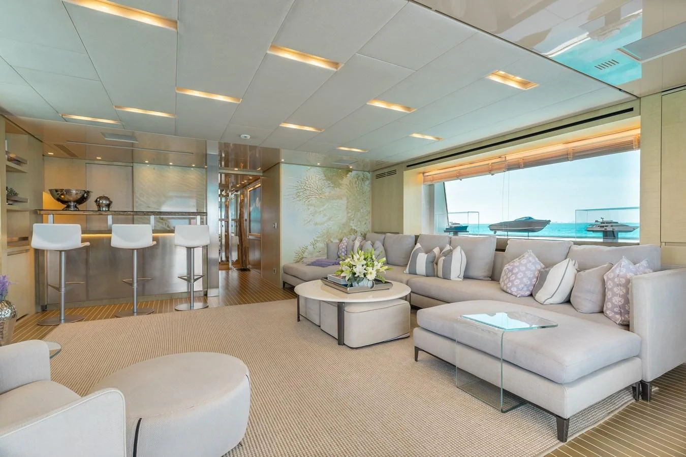 a living room with a couch and a table aboard TAKARA ONE Yacht for Charter