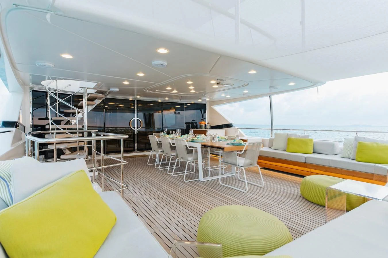 a room with tables and chairs aboard TAKARA ONE Yacht for Charter