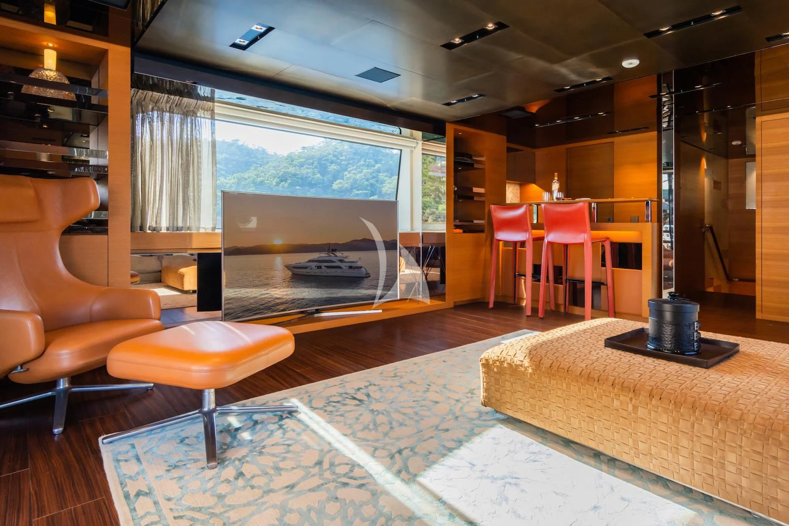 a room with a table chairs and a large window aboard TAKARA ONE Yacht for Charter