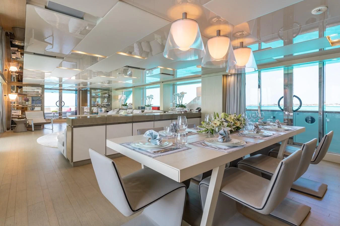 a large kitchen with a table and chairs aboard TAKARA ONE Yacht for Charter