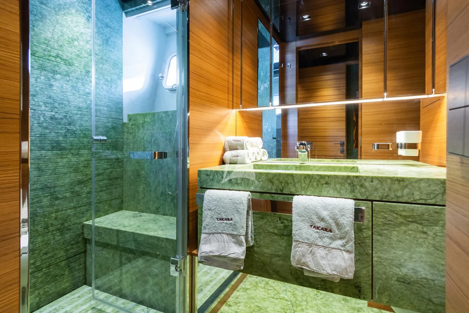 a bathroom with a glass shower aboard TAKARA ONE Yacht for Charter