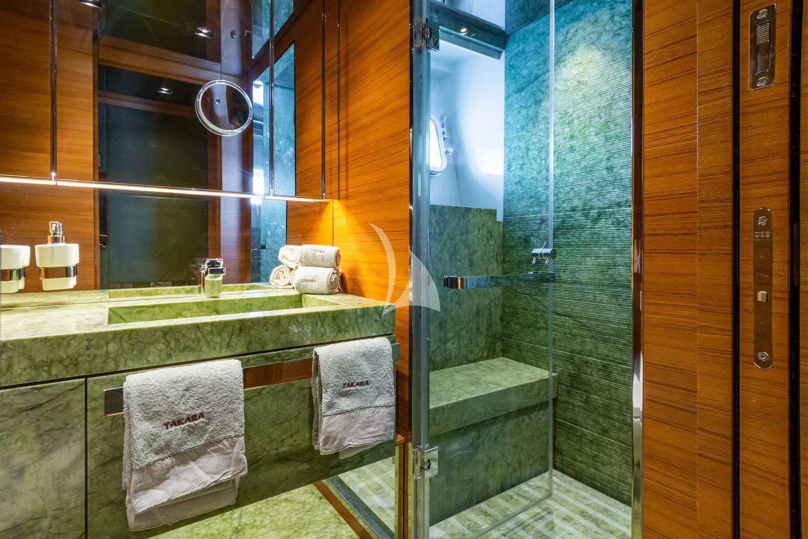 a bathroom with a glass shower aboard TAKARA ONE Yacht for Charter
