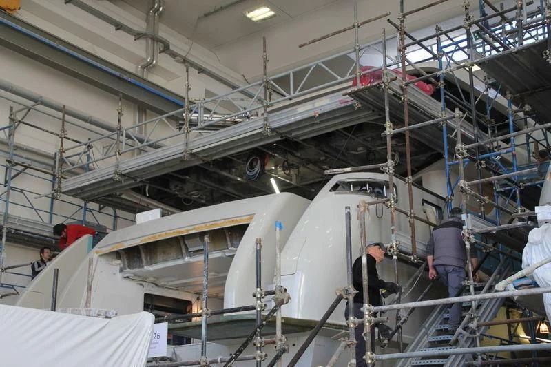 a group of people working in a factory aboard TAKARA ONE Yacht for Charter