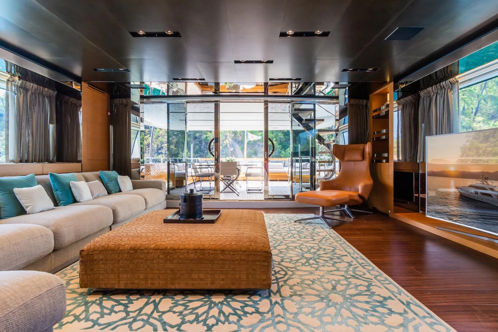 a living room with a large glass window aboard TAKARA ONE Yacht for Charter