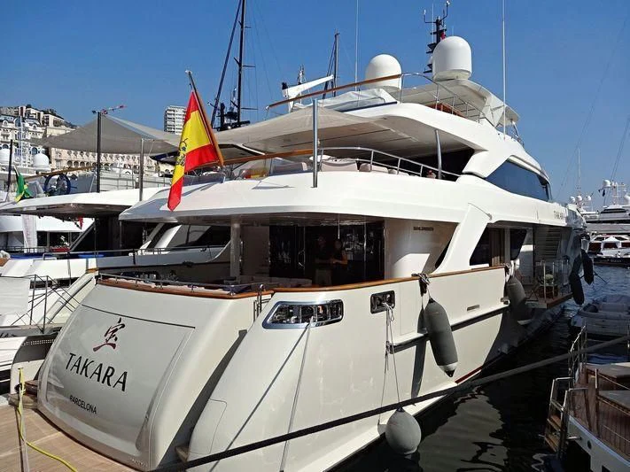 a boat docked at a pier aboard TAKARA ONE Yacht for Charter