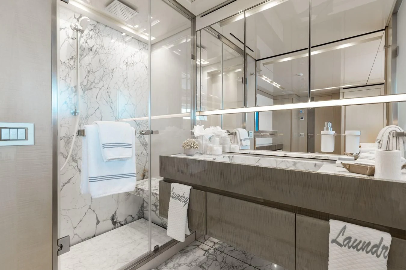 a bathroom with a large mirror aboard TAKARA ONE Yacht for Charter