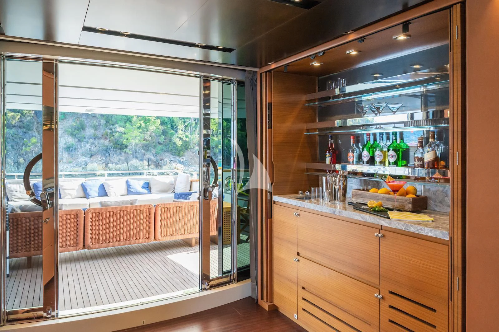 a kitchen with a glass door aboard TAKARA ONE Yacht for Charter
