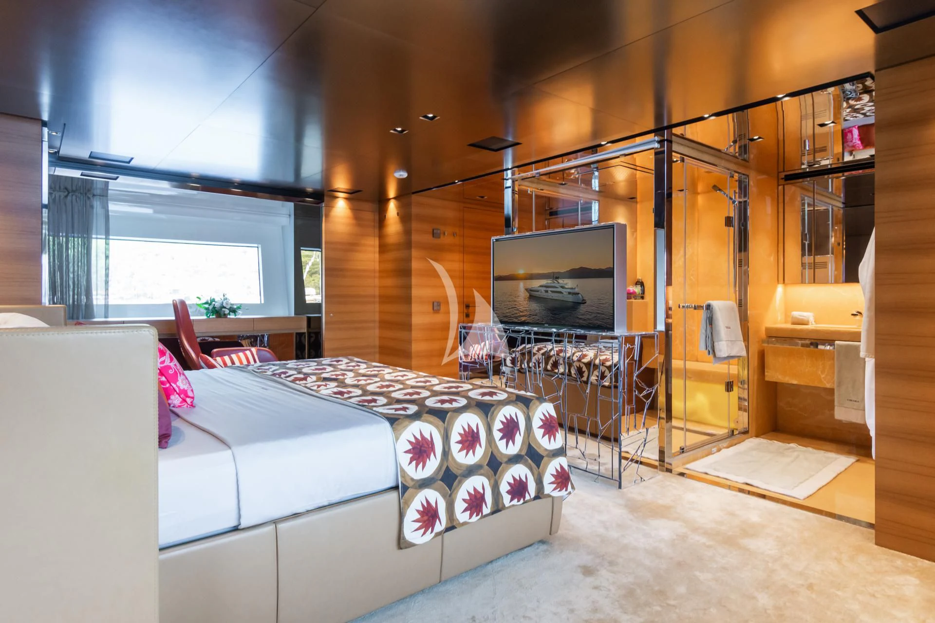 a room with a bed and a tv aboard TAKARA ONE Yacht for Charter