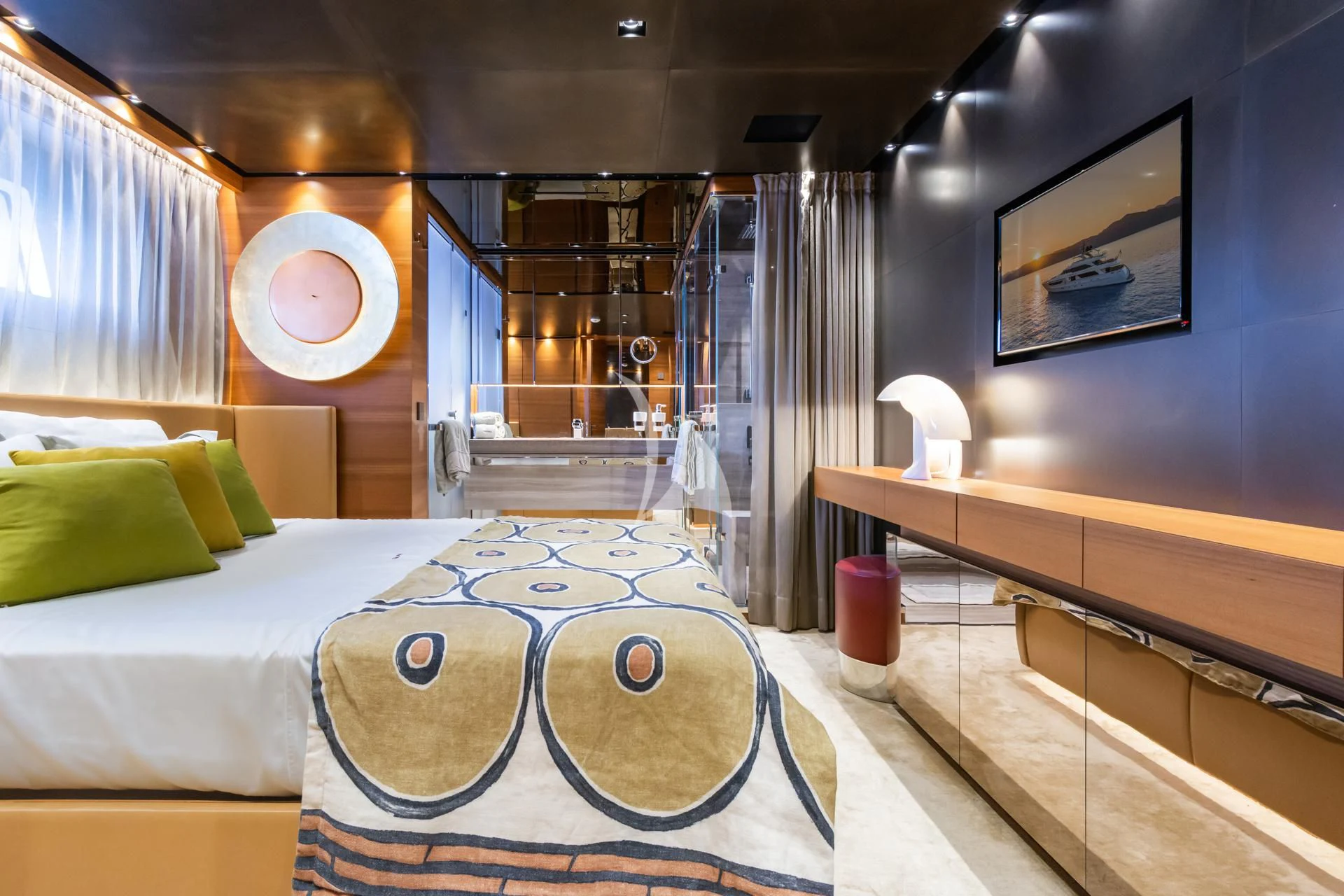 a room with a bed and a table aboard TAKARA ONE Yacht for Charter