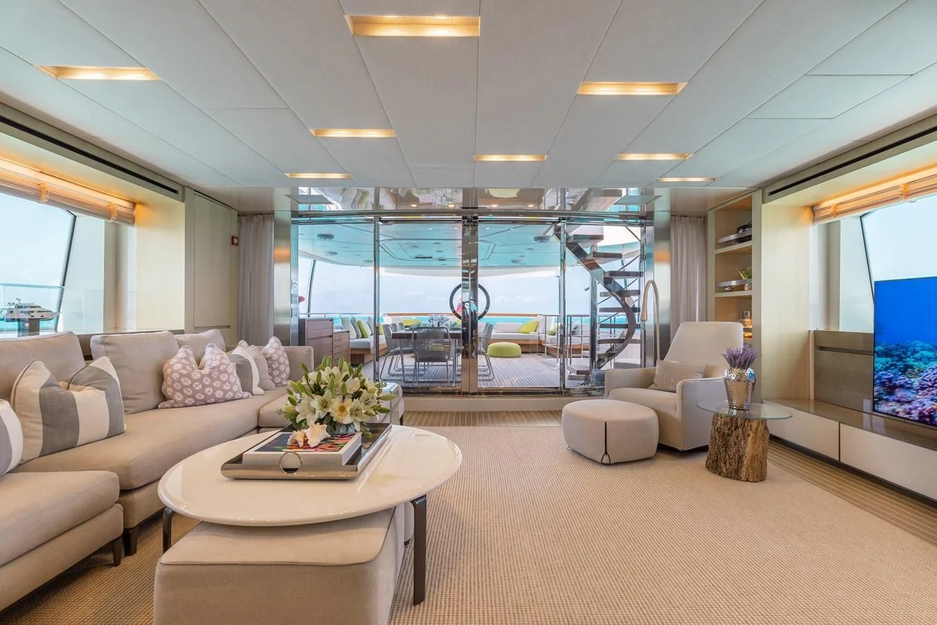 a living room with a large glass window aboard TAKARA ONE Yacht for Charter
