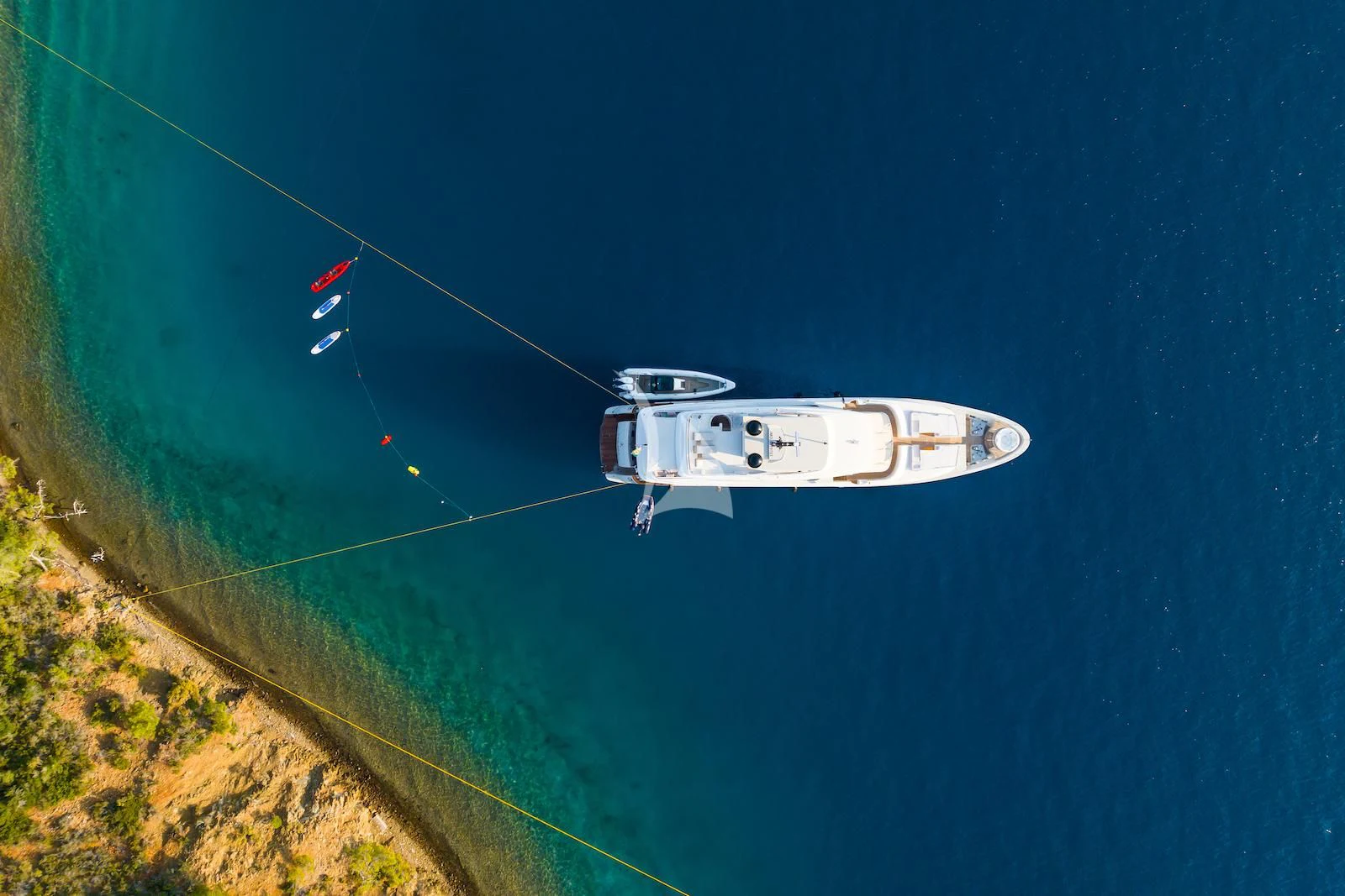 a white car in the air aboard TAKARA ONE Yacht for Charter