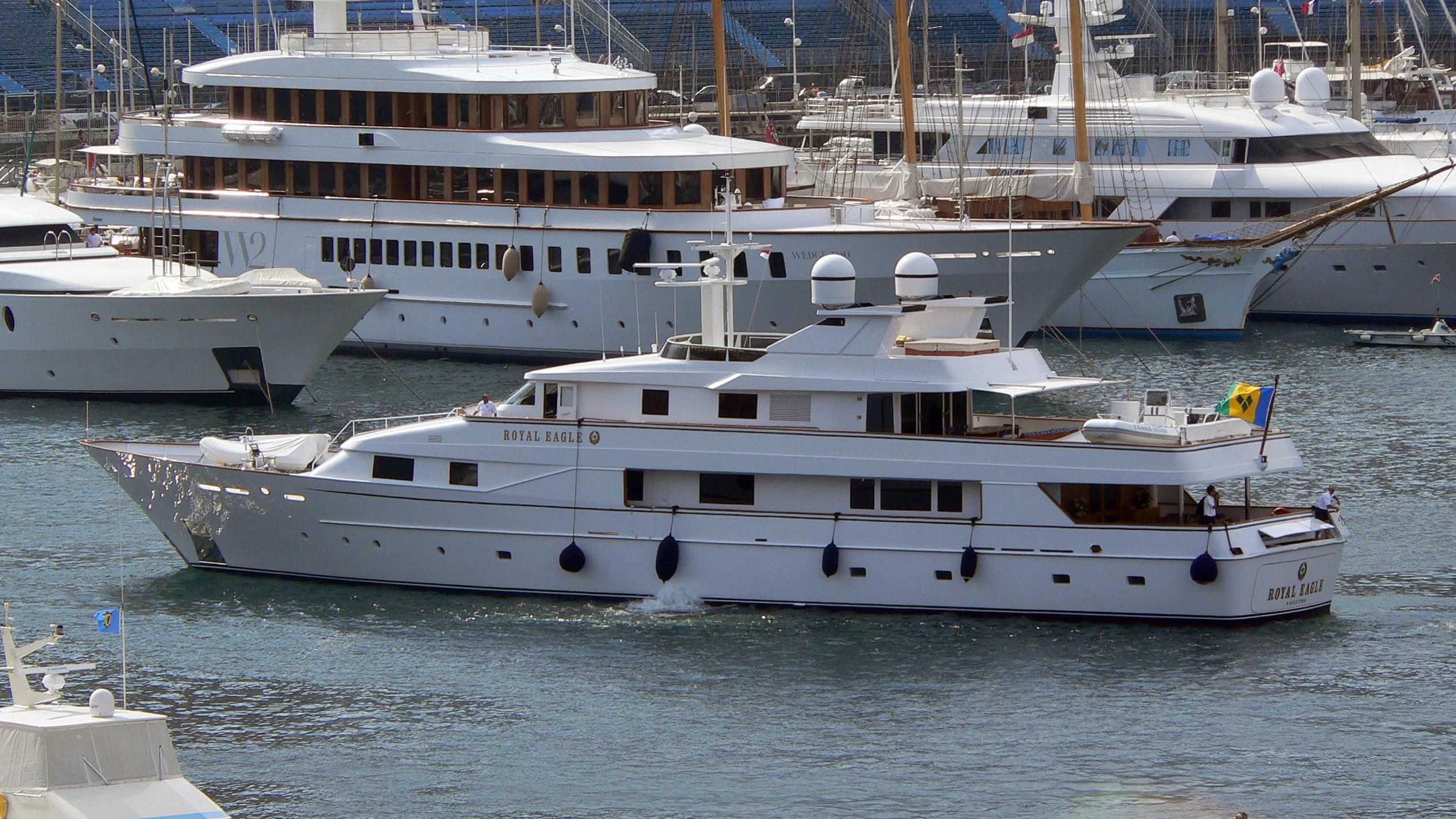a group of white yachts in the water aboard NATALIA V Yacht for Sale