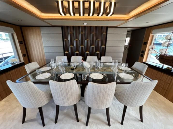 a table set for a dinner aboard CAROBELLE Yacht for Sale