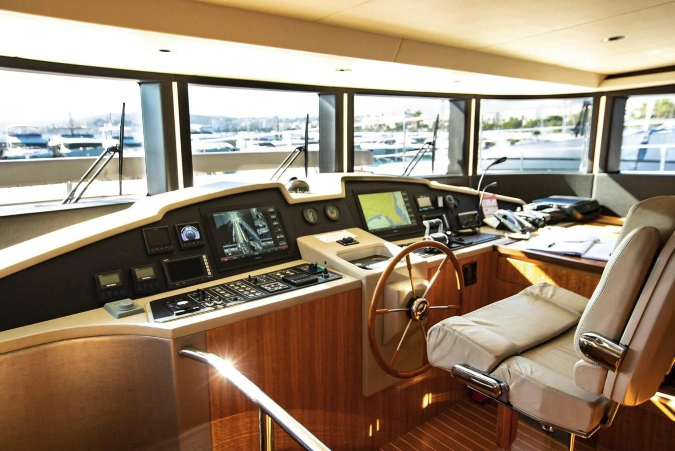 inside of a vehicle with a desk and computer and a large window aboard CAROBELLE Yacht for Sale
