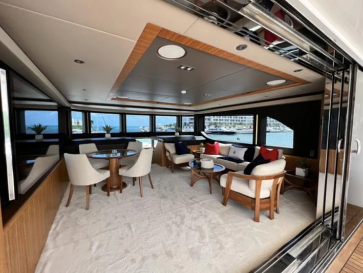 a room with a table and chairs aboard CAROBELLE Yacht for Sale