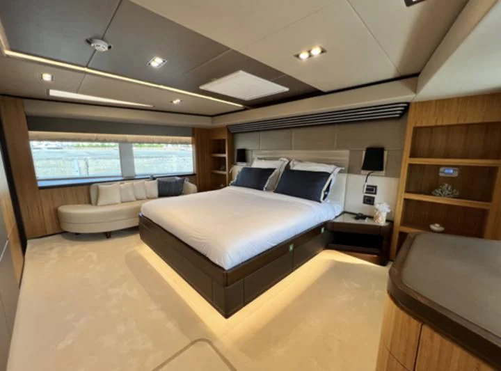 a room with a bed and a tv aboard CAROBELLE Yacht for Sale