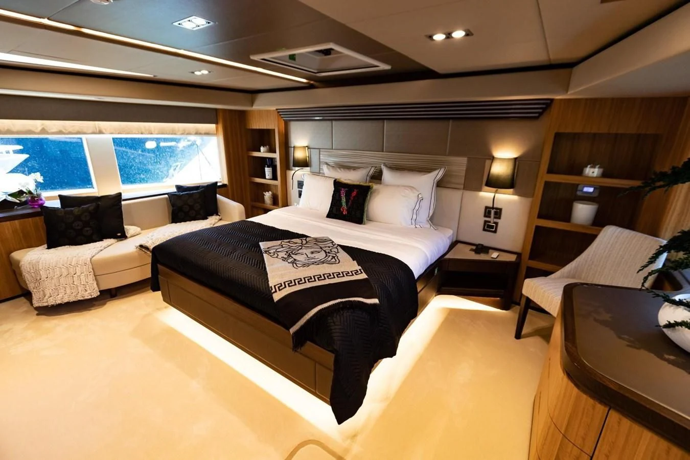 a room with a bed and a desk aboard CAROBELLE Yacht for Sale