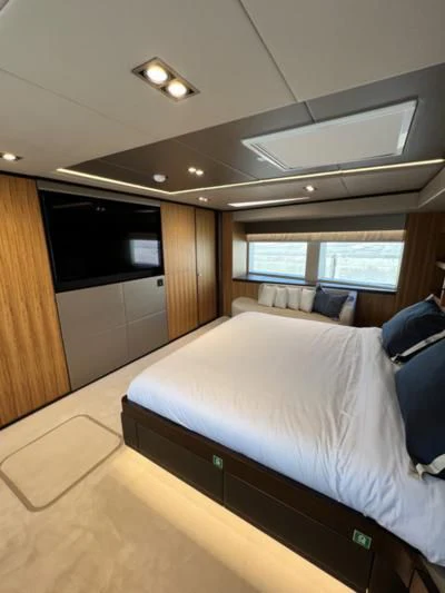 a bed in a room aboard CAROBELLE Yacht for Sale