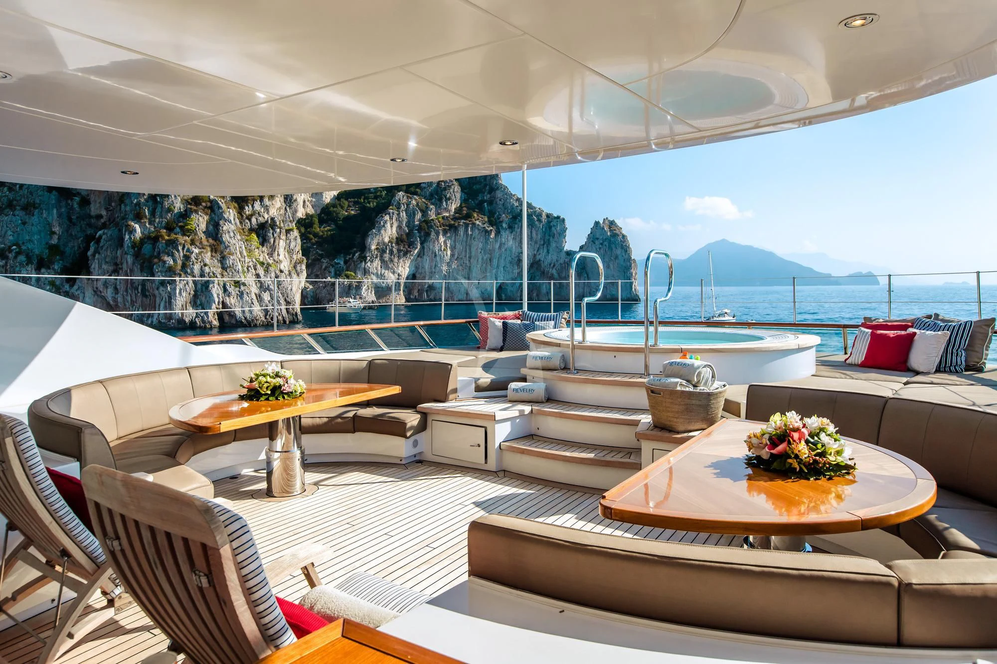 a room with a table and chairs aboard SARON Yacht for Sale