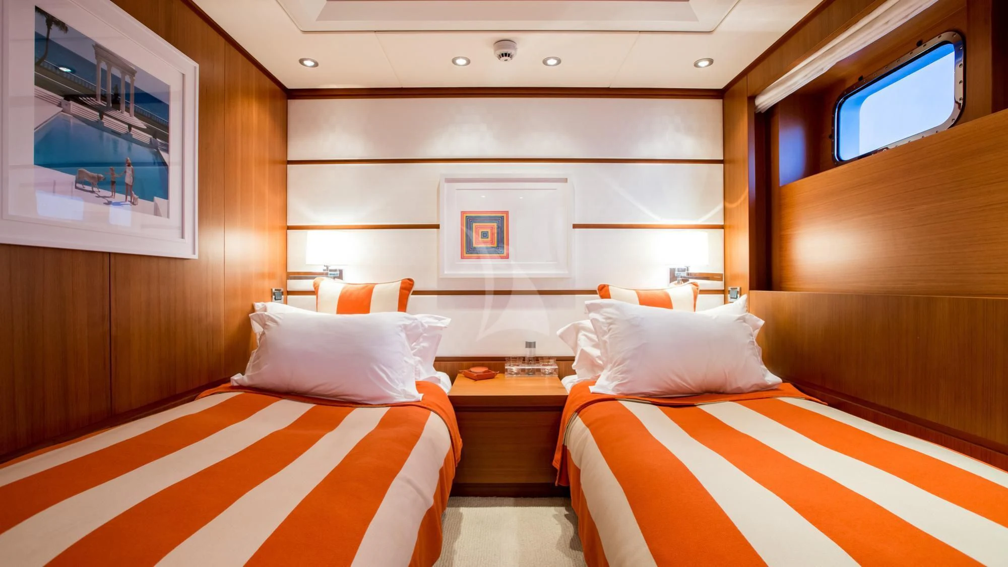 a room with a bed and a window aboard SARON Yacht for Sale