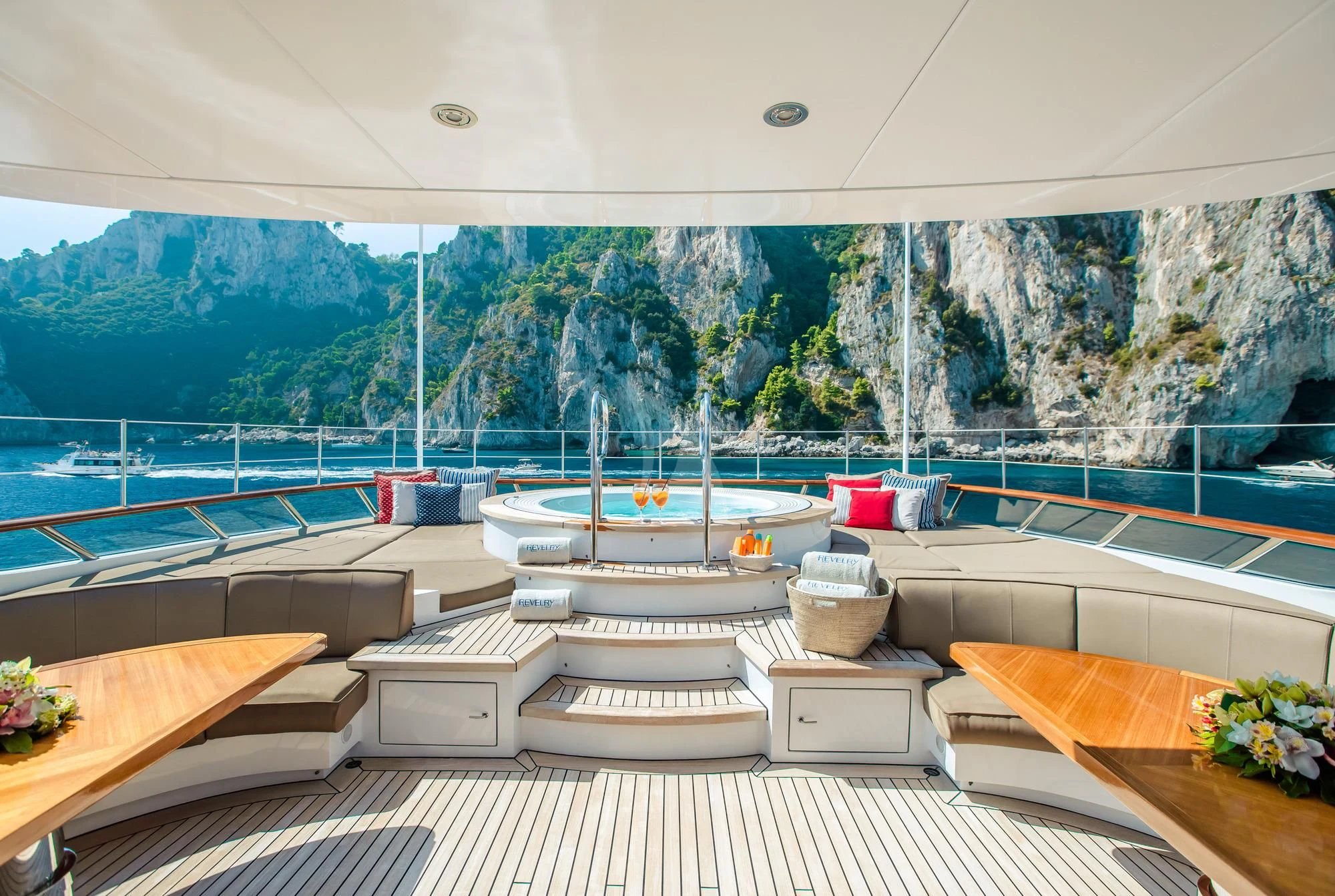 a room with a pool and a view of mountains and trees aboard SARON Yacht for Sale