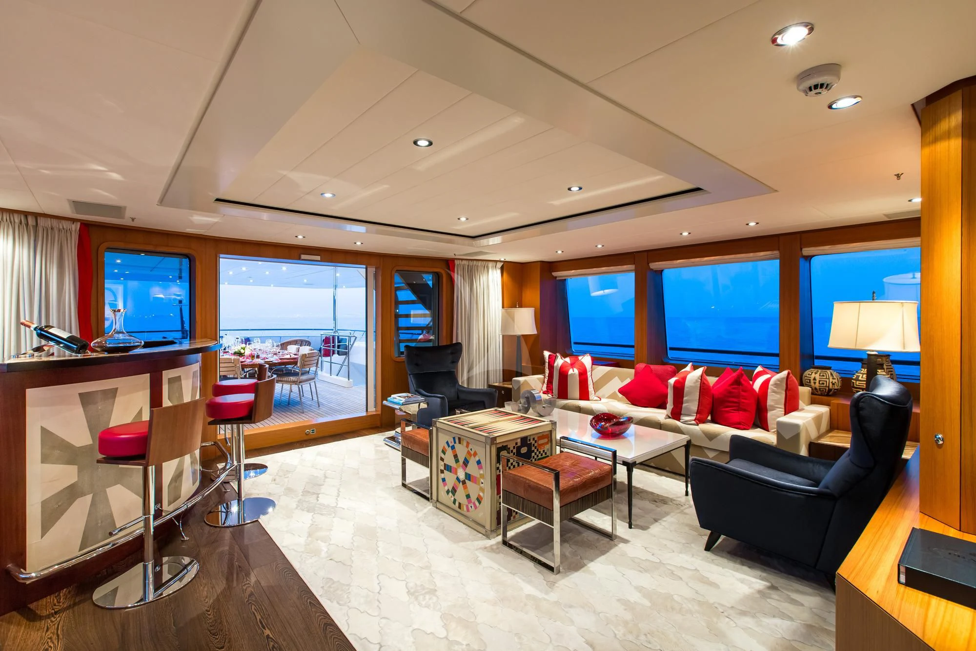 a living room with a large screen aboard SARON Yacht for Sale