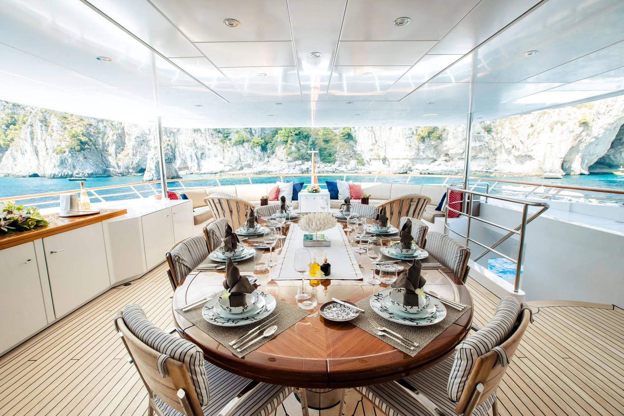 a dining room with a large window aboard SARON Yacht for Sale