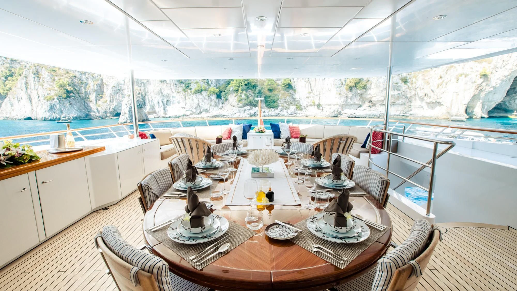 a large room with a table and chairs aboard SARON Yacht for Sale