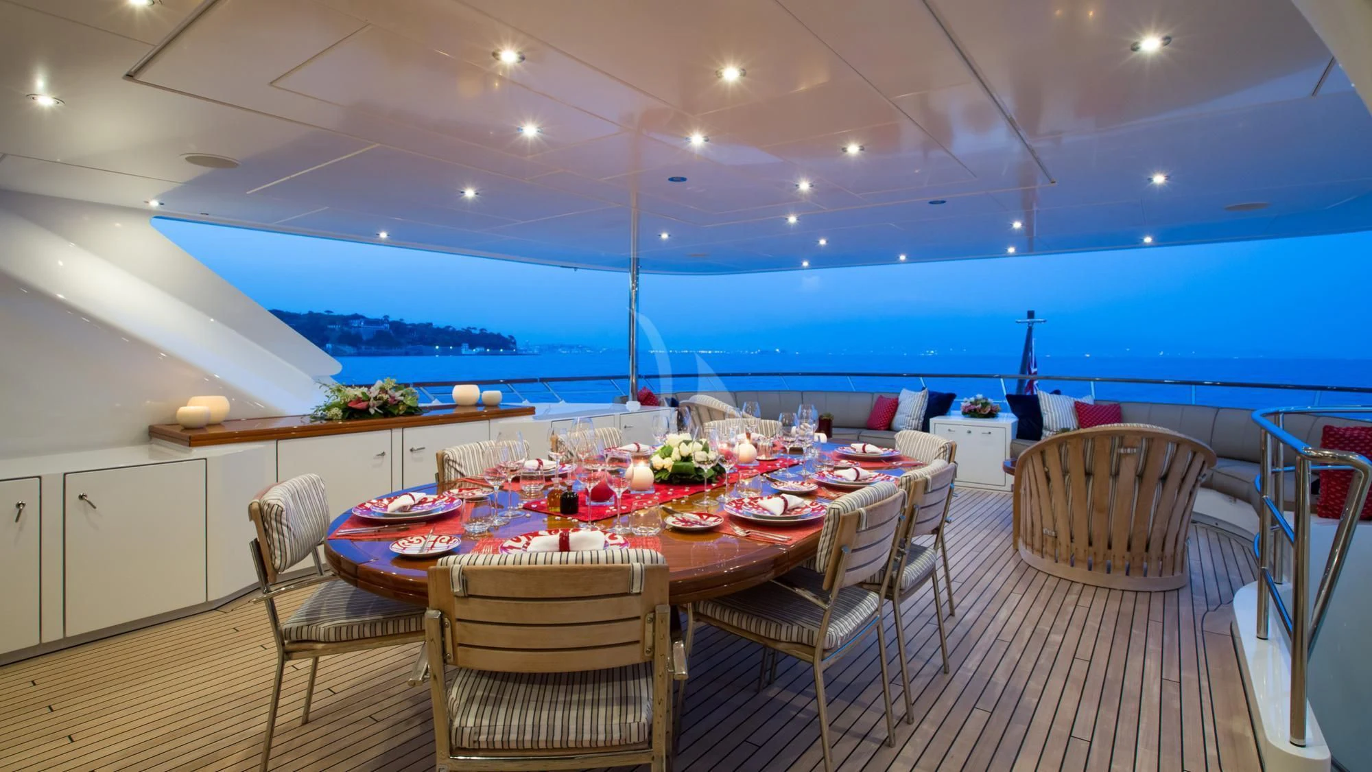 a dining room with a large body of water and a large blue sky aboard SARON Yacht for Sale