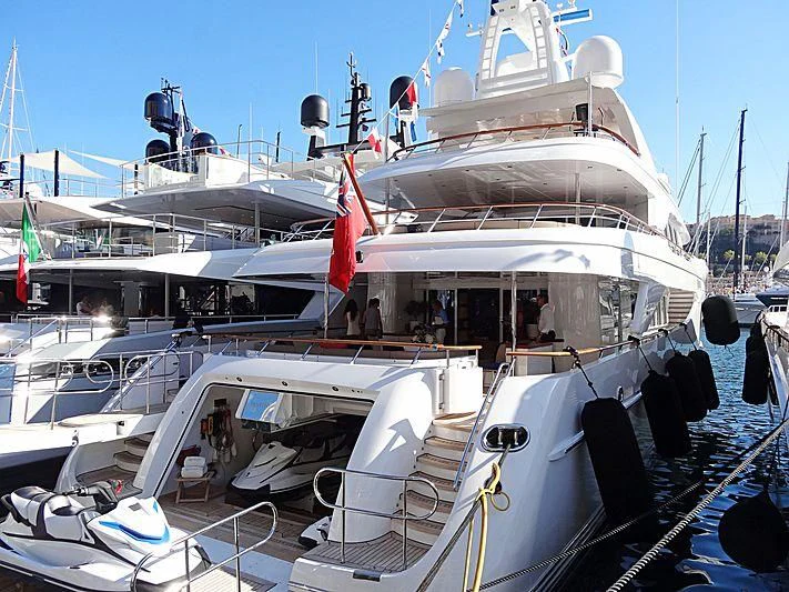 a boat with a flag on the deck aboard SARON Yacht for Sale