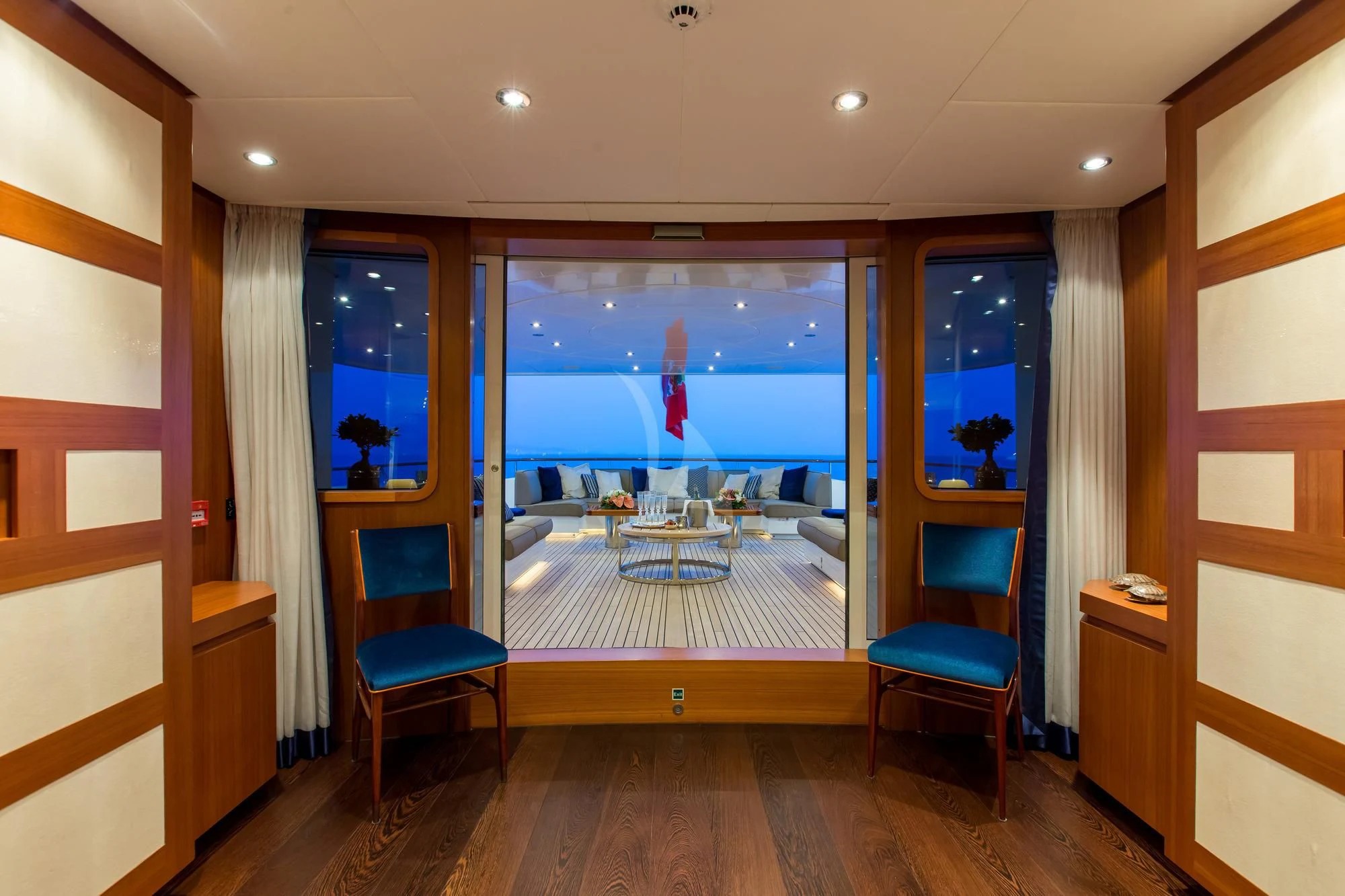 a room with a view of the water and the beach aboard SARON Yacht for Sale
