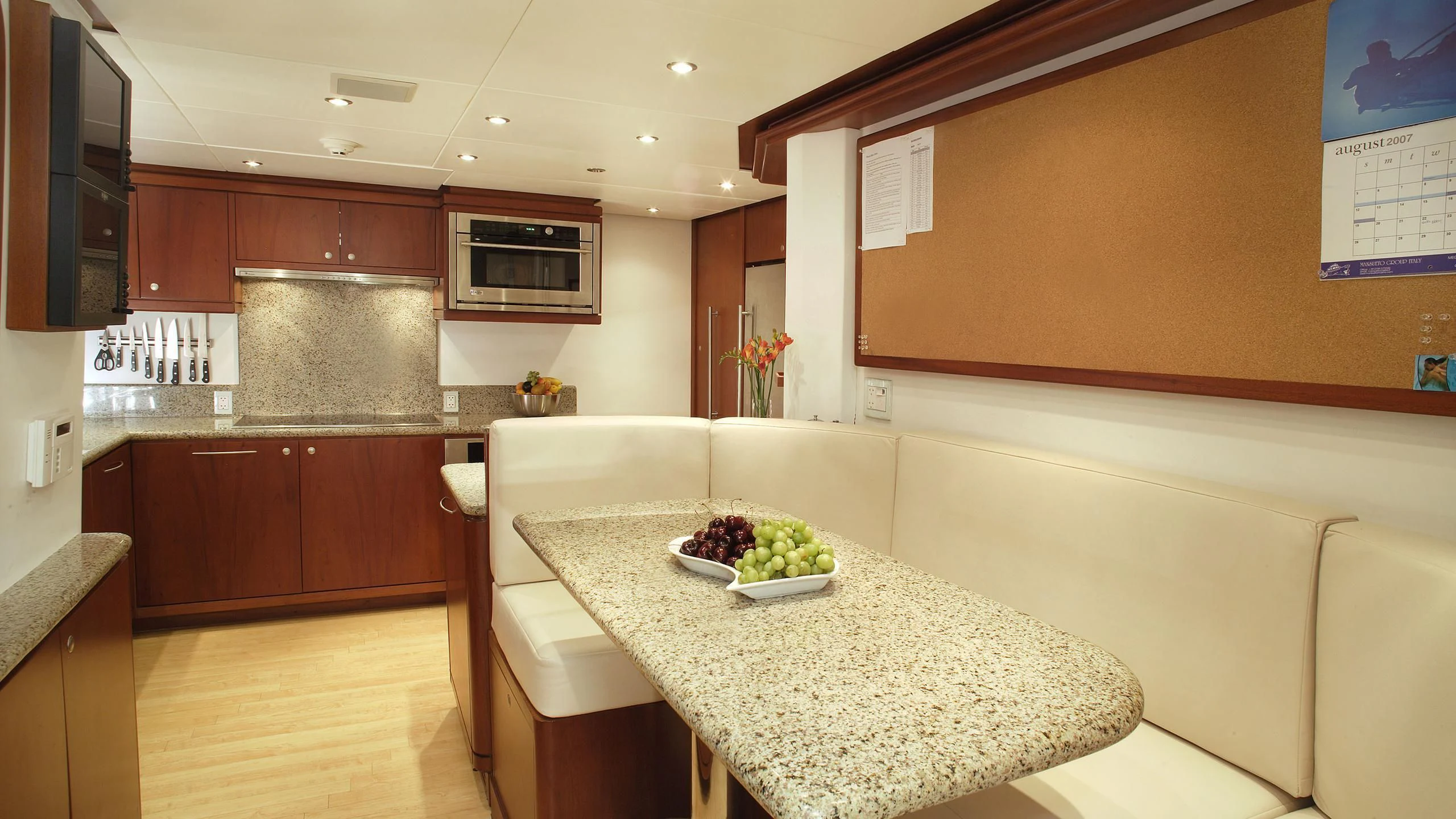 a kitchen with a large island aboard IF ONLY Yacht for Sale