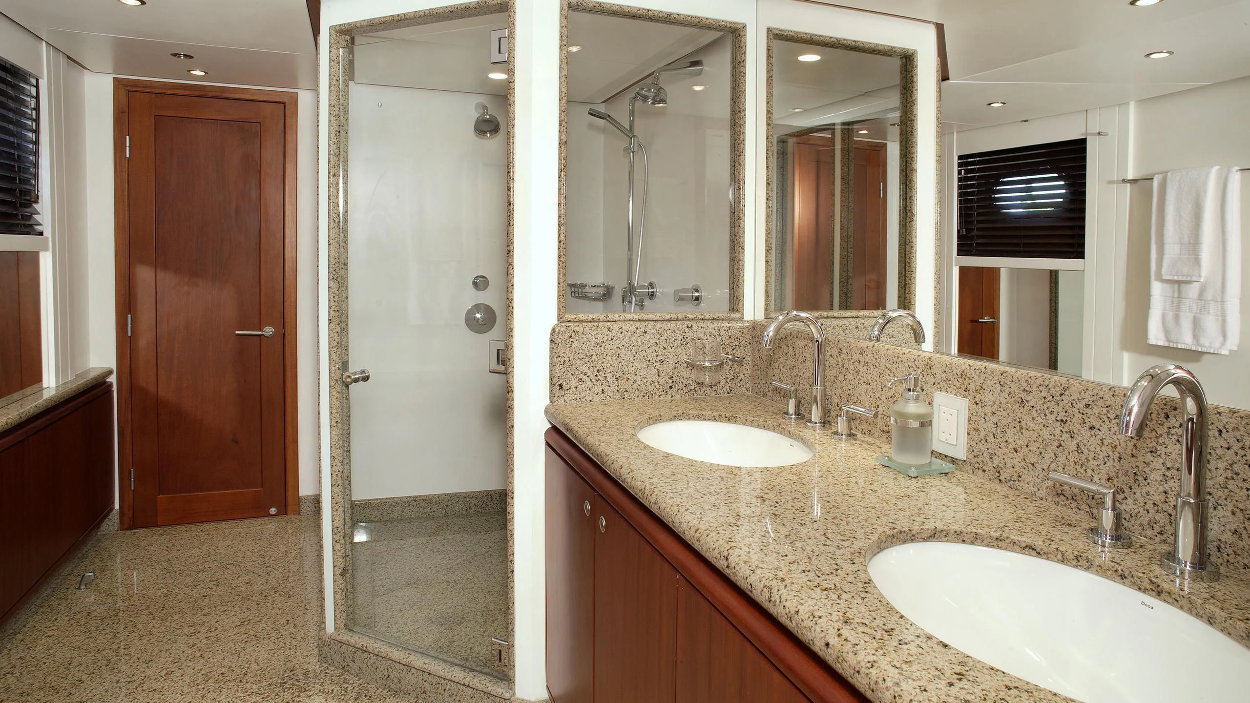 a bathroom with a countertop sink and a shower unit aboard IF ONLY Yacht for Sale