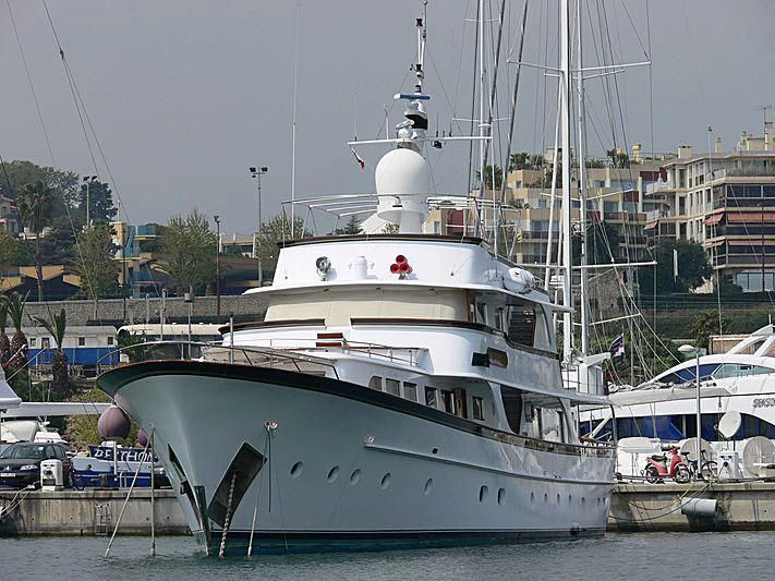 a large white boat in a harbor aboard IF ONLY Yacht for Sale