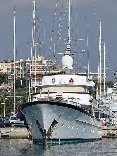 a large white boat in a harbor aboard IF ONLY Yacht for Sale