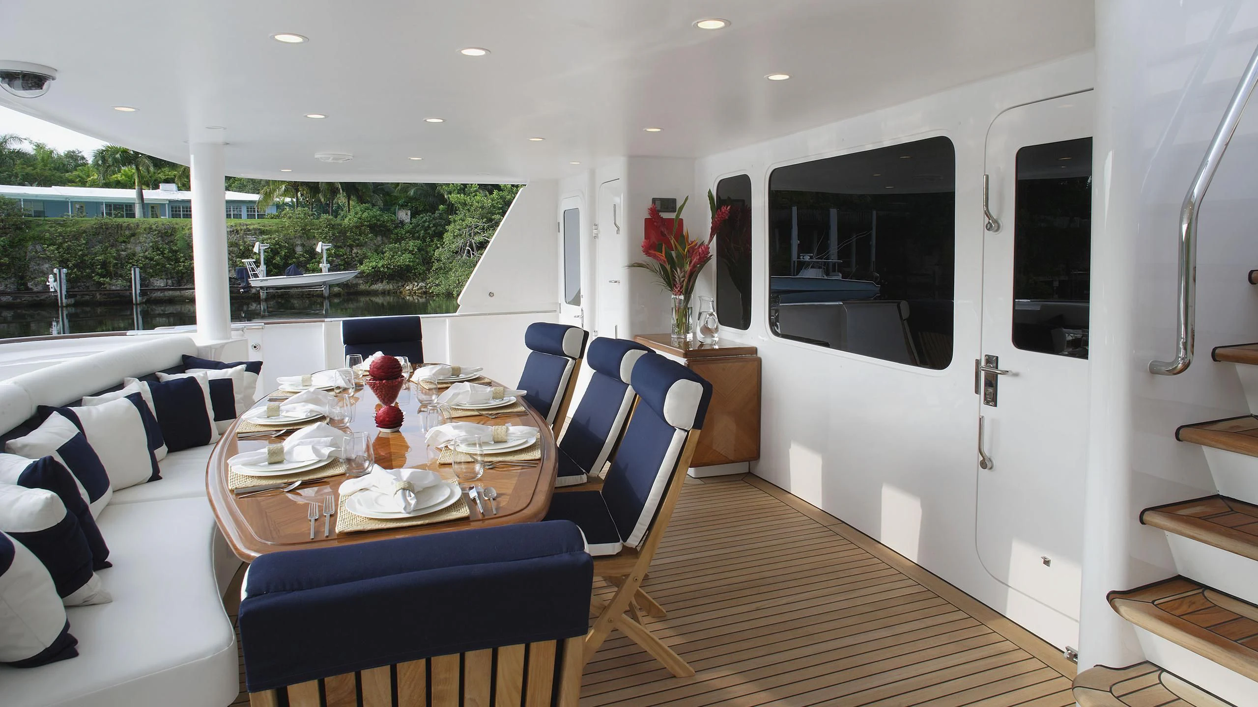 a dining room with a table and chairs aboard IF ONLY Yacht for Sale
