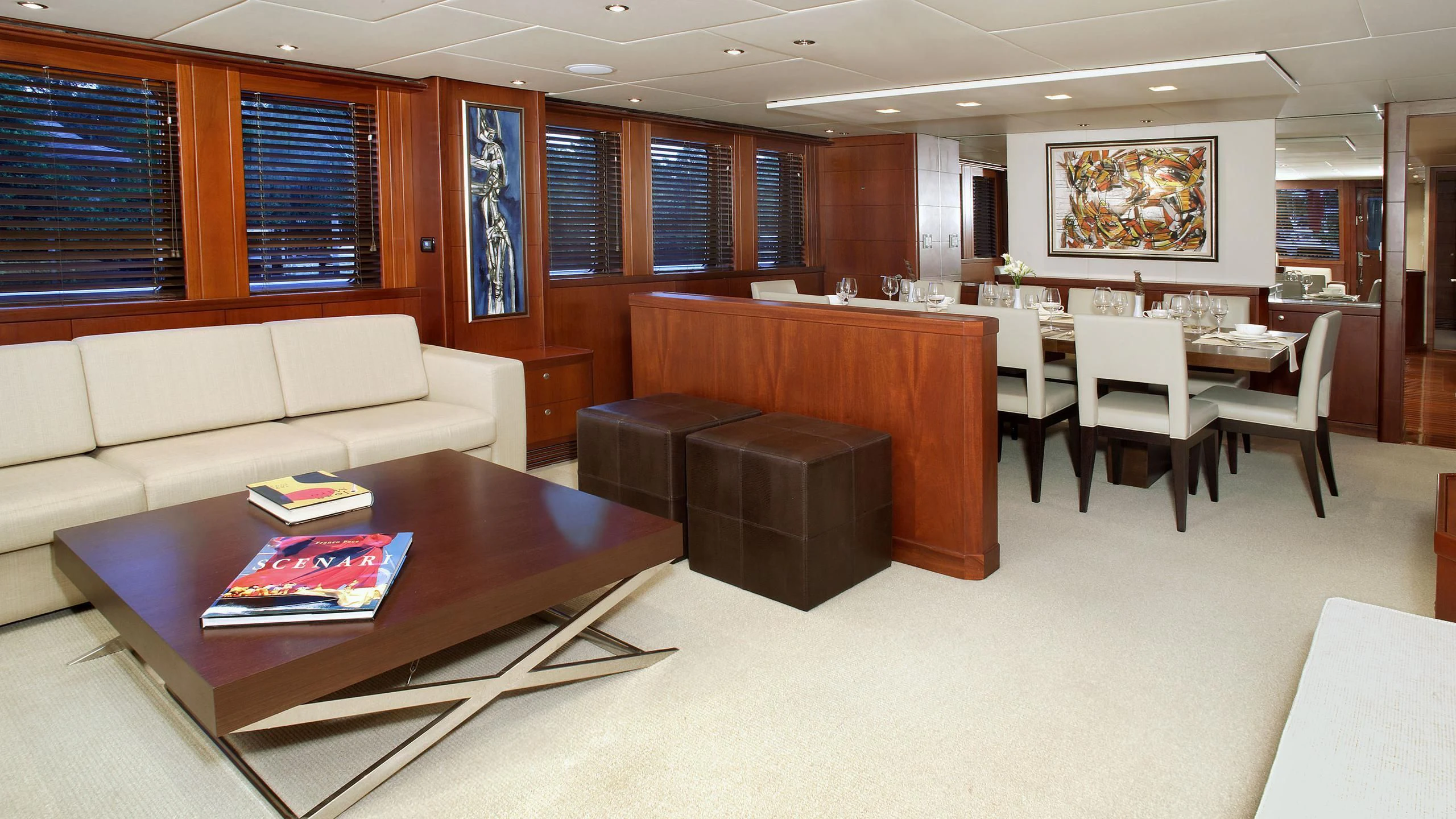a room with a couch and a table and chairs aboard IF ONLY Yacht for Sale