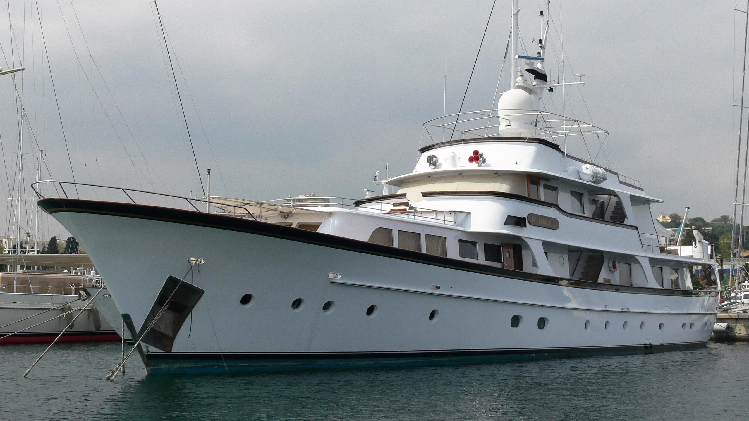 a large white boat in the water aboard IF ONLY Yacht for Sale