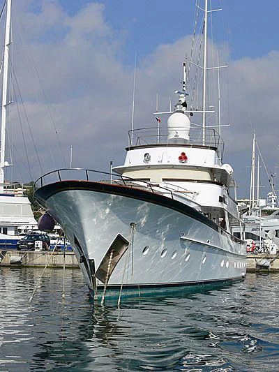 a large white boat in a harbor aboard IF ONLY Yacht for Sale