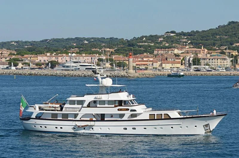 a white yacht in the water aboard IF ONLY Yacht for Sale