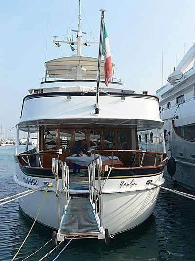 a boat docked at a pier aboard IF ONLY Yacht for Sale