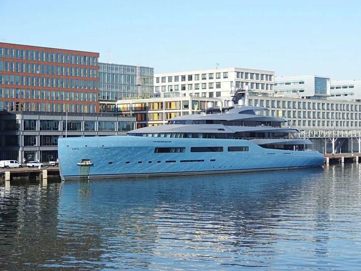a large boat in a harbor aboard AVIVA Yacht for Sale