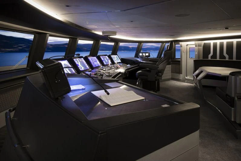 inside of a vehicle with many laptops on the table aboard AVIVA Yacht for Sale