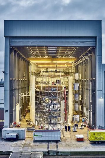 a large warehouse with several crates aboard AVIVA Yacht for Sale