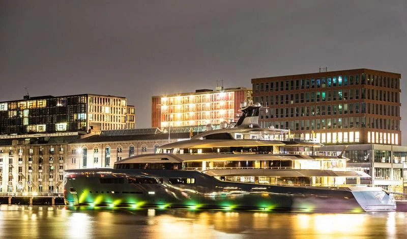 a bridge over water with buildings in the background aboard AVIVA Yacht for Sale
