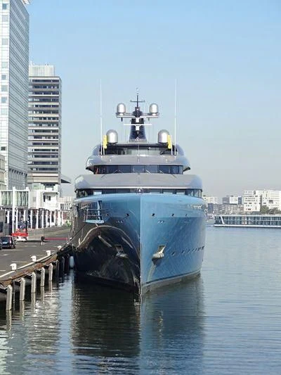 a large ship docked at a pier aboard AVIVA Yacht for Sale