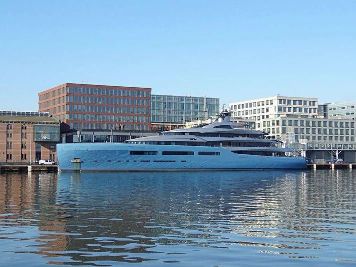 a large cruise ship in a harbor aboard AVIVA Yacht for Sale