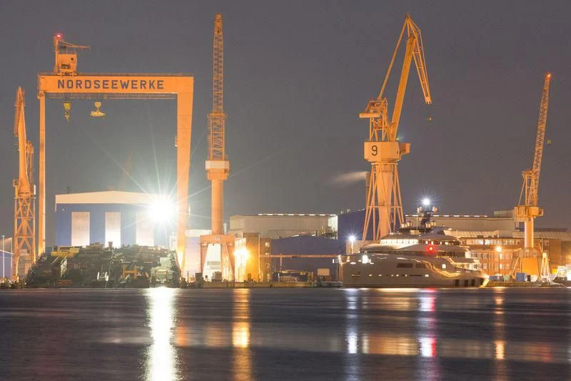 a large crane next to a body of water aboard AVIVA Yacht for Sale