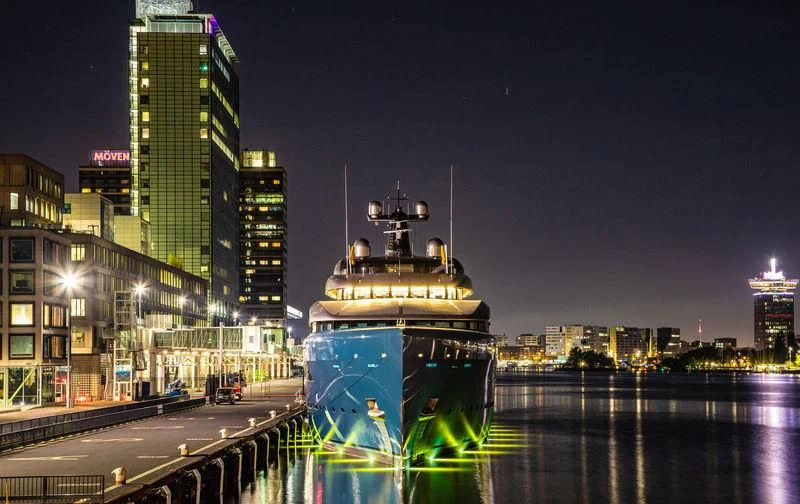 a large boat in a city aboard AVIVA Yacht for Sale