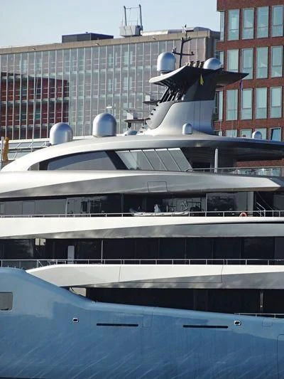 a boat docked in front of a building aboard AVIVA Yacht for Sale